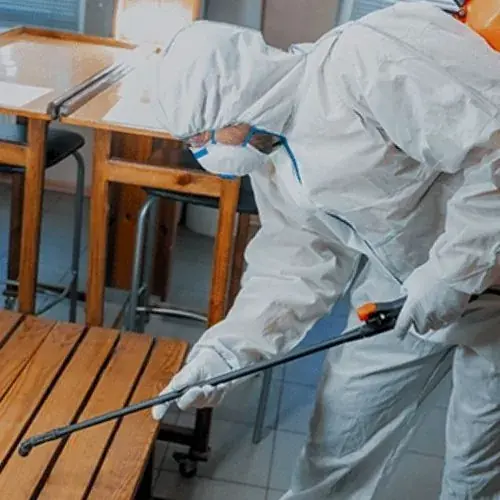 Technicians extracting water in protective gear in Oklahoma City