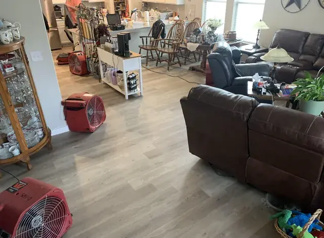 Drying equipment in a water damaged Oklahoma City living room