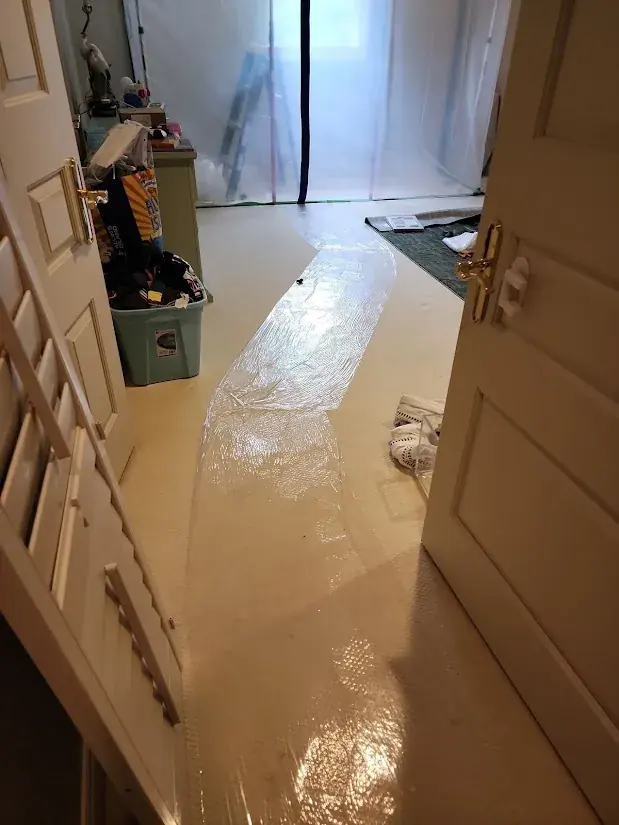 Standing flood water covering the living room floor of an Oklahoma City home after a spring storm