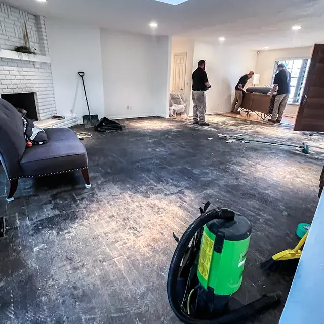 Water damaged floor being cleared in an Oklahoma City home