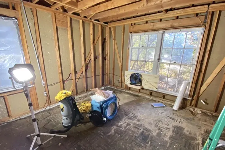 Basement water damage with exposed studs in an Oklahoma City home